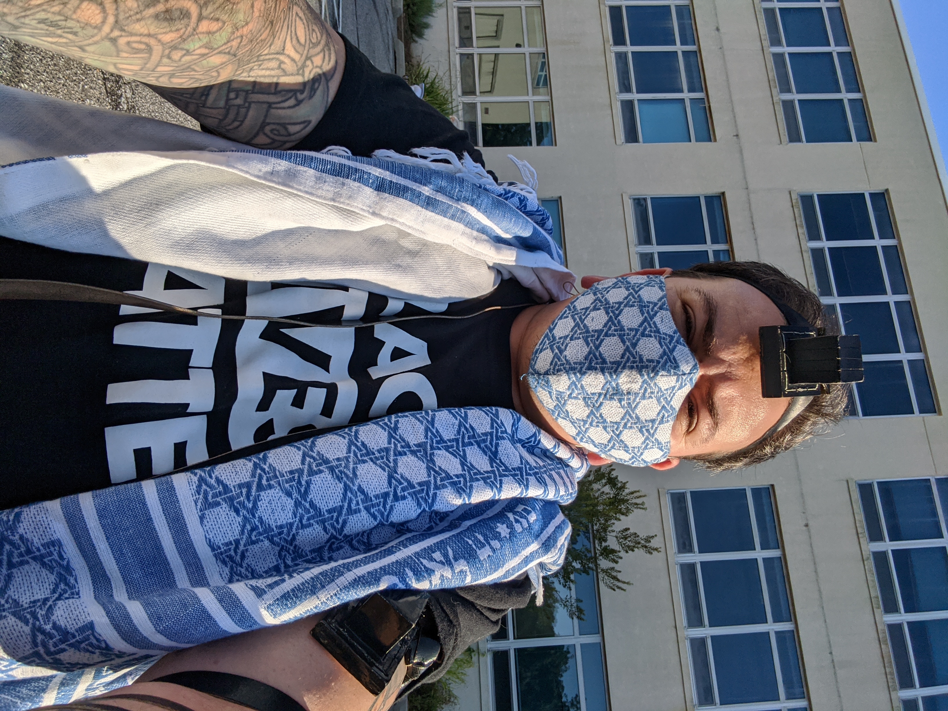 Wearing a Tallis and mask of matching fabric during a socially distanced minyan for Rosh Chodesh Elul.